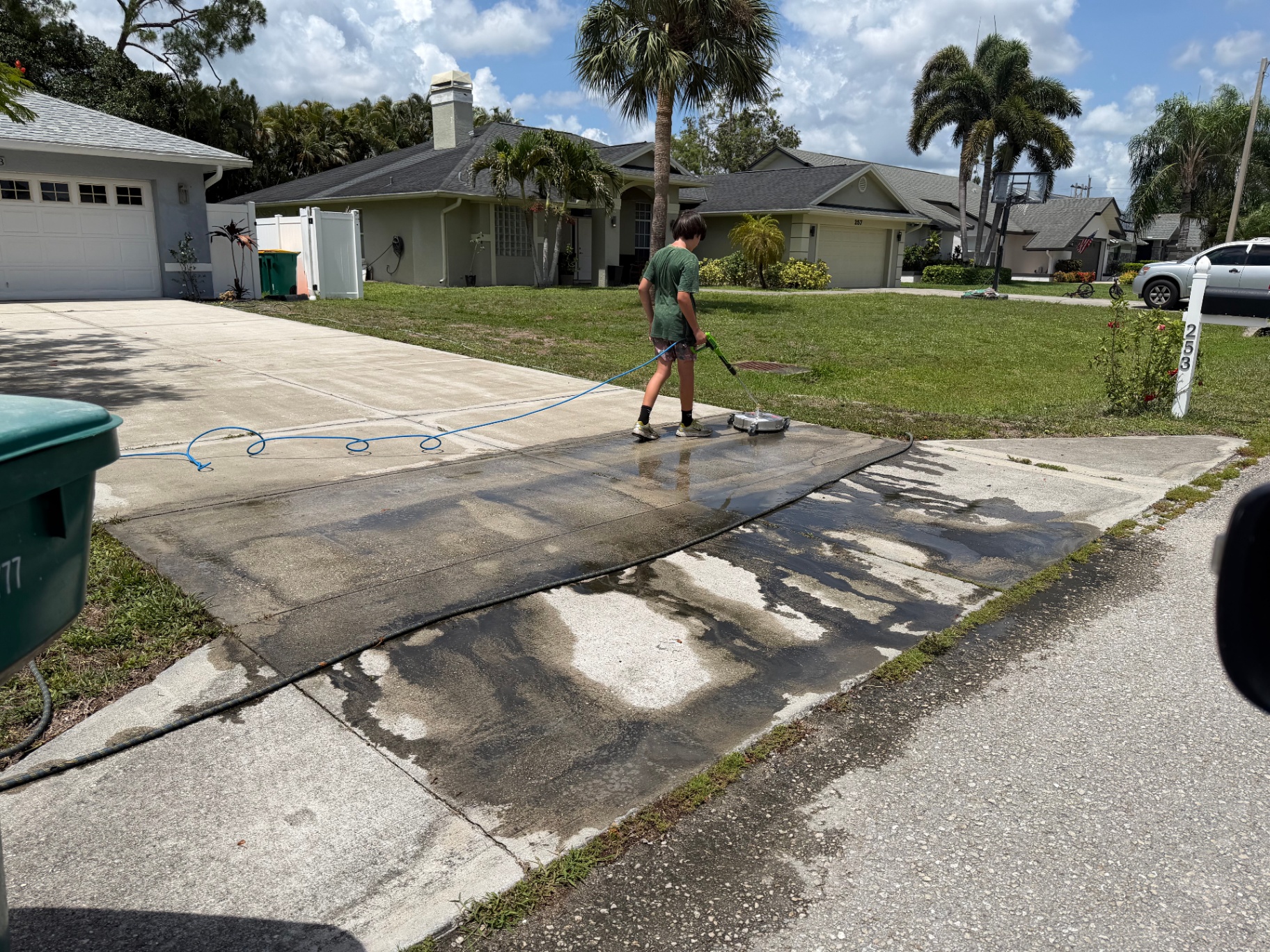 Driveway being pressure washed in Naples, FL